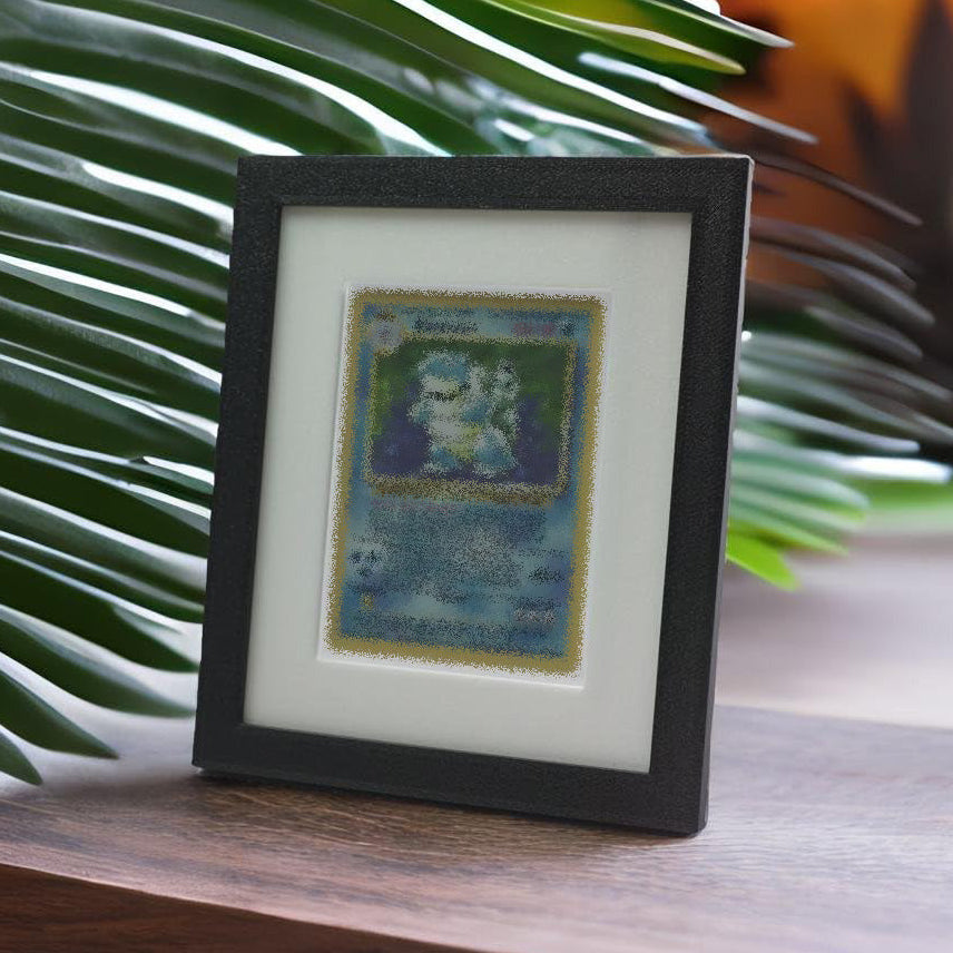 Trading card art frame on a wooden surface with green leaves in the background